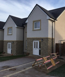 An image of a set of houses we plastered