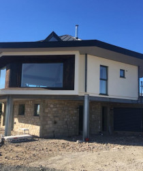 An image of a stylish modern house we plastered