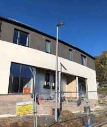 An image of a modern style apartment block we plastered