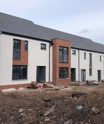 An image of a modern style apartment block we plastered