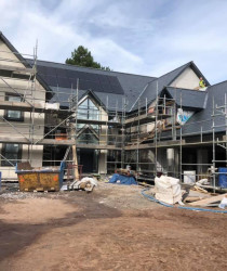 An image of a house we worked on surrounded by scaffolding
